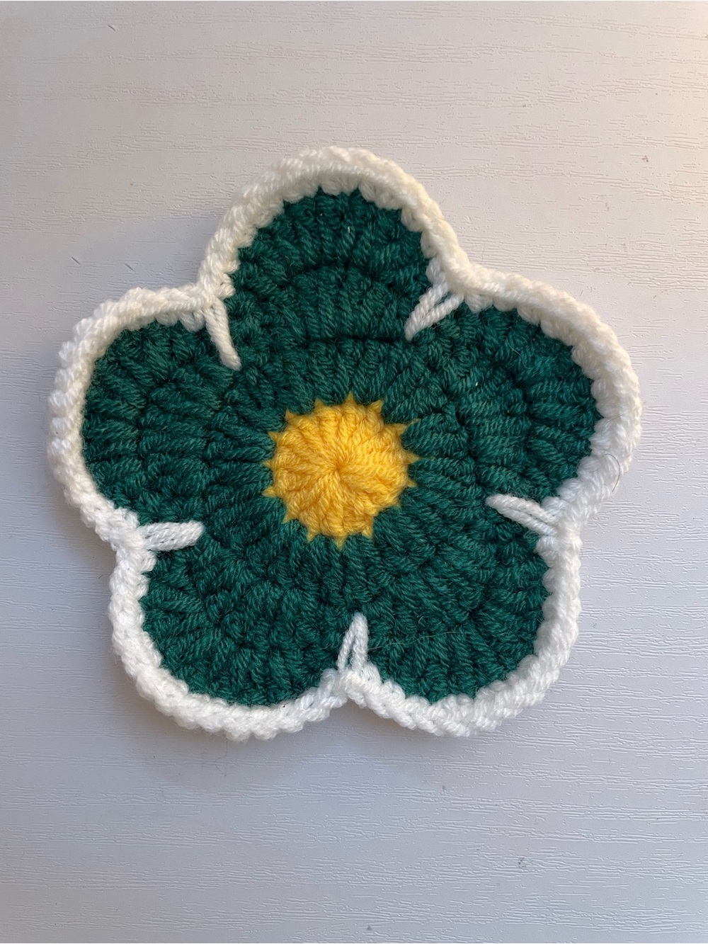 Crochet dark green flower coaster